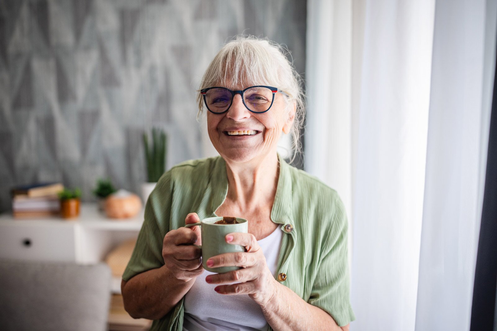 sl_better-living-floor-plans-banner-woman-with-mug