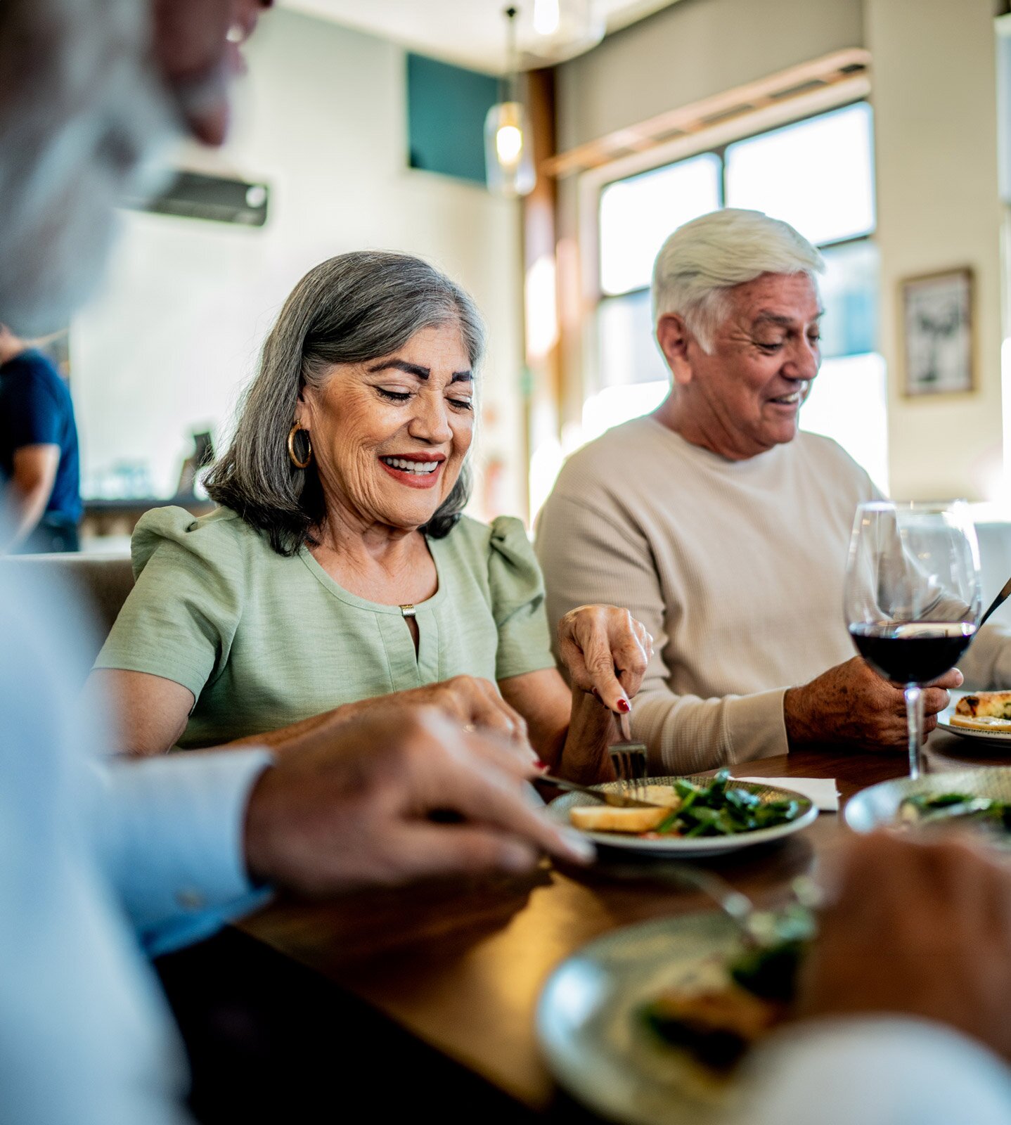 Senior couple enjoying dinner at restaurant table