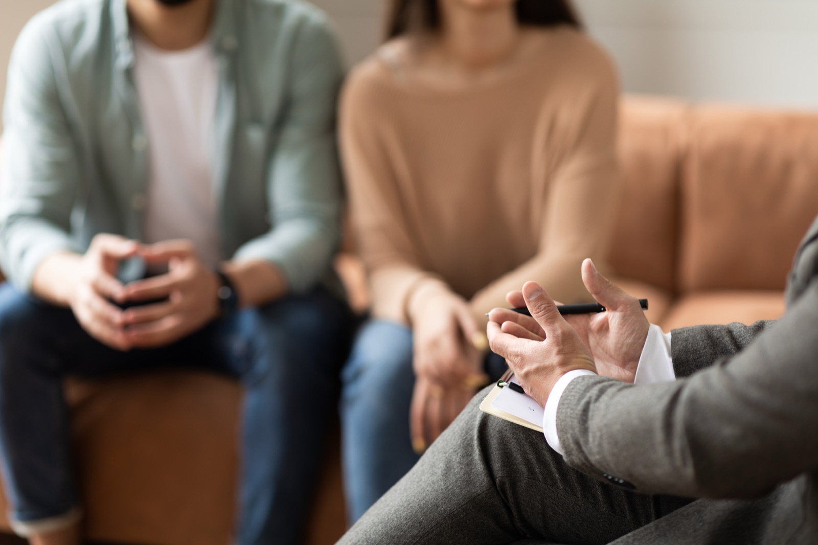 Therapist counseling couple during session in office