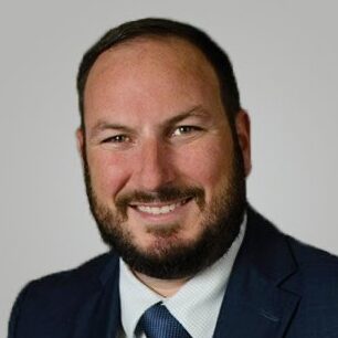 Smiling man in blue suit and tie
